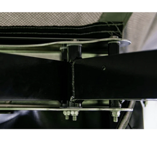 Close-up of a metal frame structure with bolts and straps.