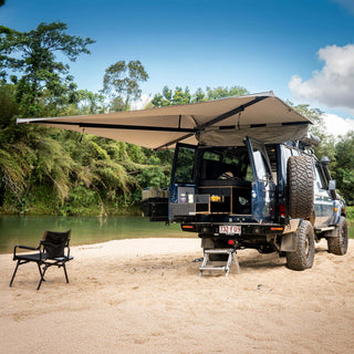 Destination 4WD D270 freestanding 270 degree awning set up on a 4WD at a riverside camp