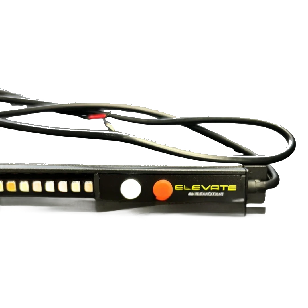 Close up of the switch end of the Elevate dual colour LED strip light, showing the white button for the white LEDs and the orange button for the amber, with Elevate Automotive branding and the two core tail