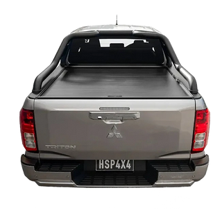 Back view of a silver Mitsubishi truck with a tonneau cover on a white background – HSP Electric Roller Cover Mitsubishi Triton MV