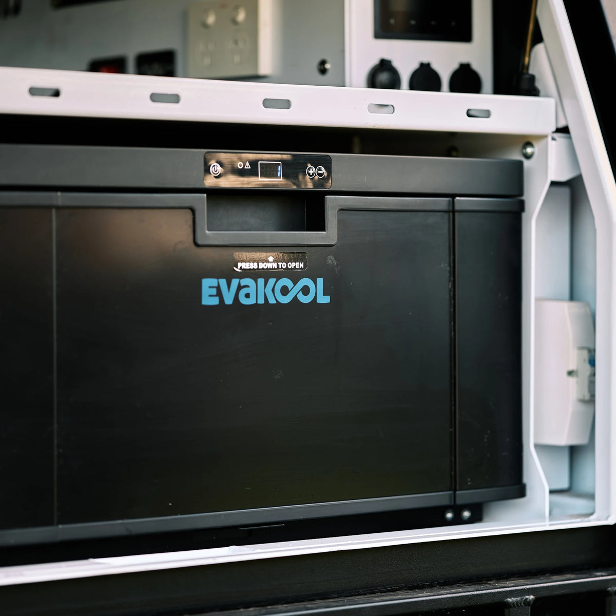 EvaKool 40L Platinum drawer fridge mounted in a vehicle storage system, front panel with EvaKool logo