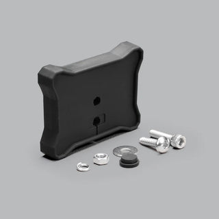 Flat mount with all its hardware laid out: the black moulded pad, a spring washer, a hex nut, a flat washer, a rubber blanking plug and two stainless socket screws