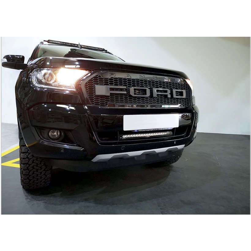 Black Ford Ranger truck front view in a showroom setting with Lazer Lamps Bumper Beam Mount Kit – Ford Ranger (2016–2022)