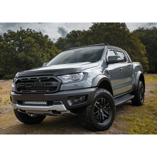 Silver Ford Ranger parked on a dirt road with trees in the background with Lazer Lamps Roof Mount Kit – Ford Ranger (2016+ No Roof Rails)