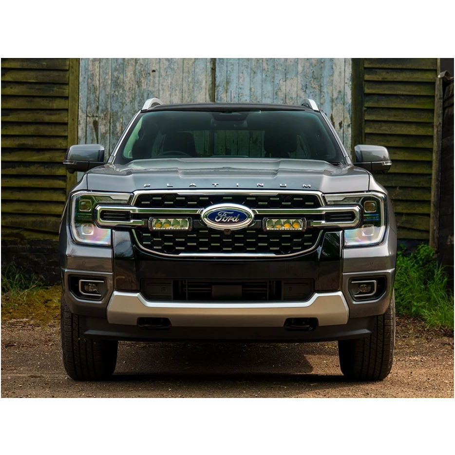 Lazer Lamps Grille Kit for Ford Ranger Platinum (2023+) parked in front of a rustic wooden building