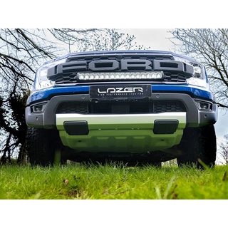 Ford Ranger Raptor (2023+) Grille Kit – front view of a Ford ute with Lazer performance lighting system on a grassy area.