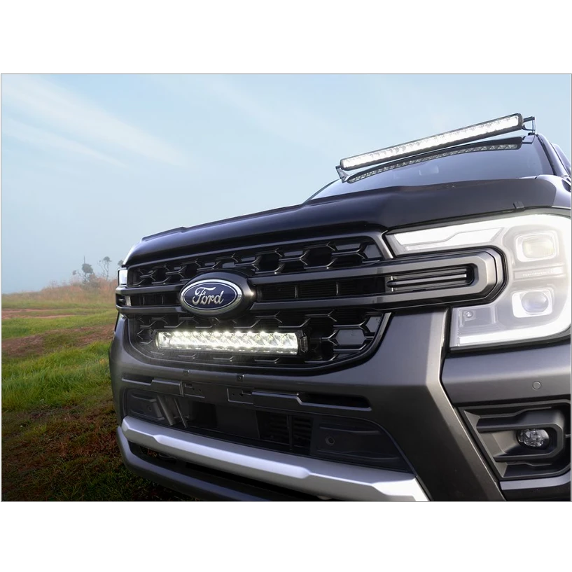 Ford truck with LED lights on a grassy field