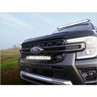 Ford truck with LED lights on a grassy field