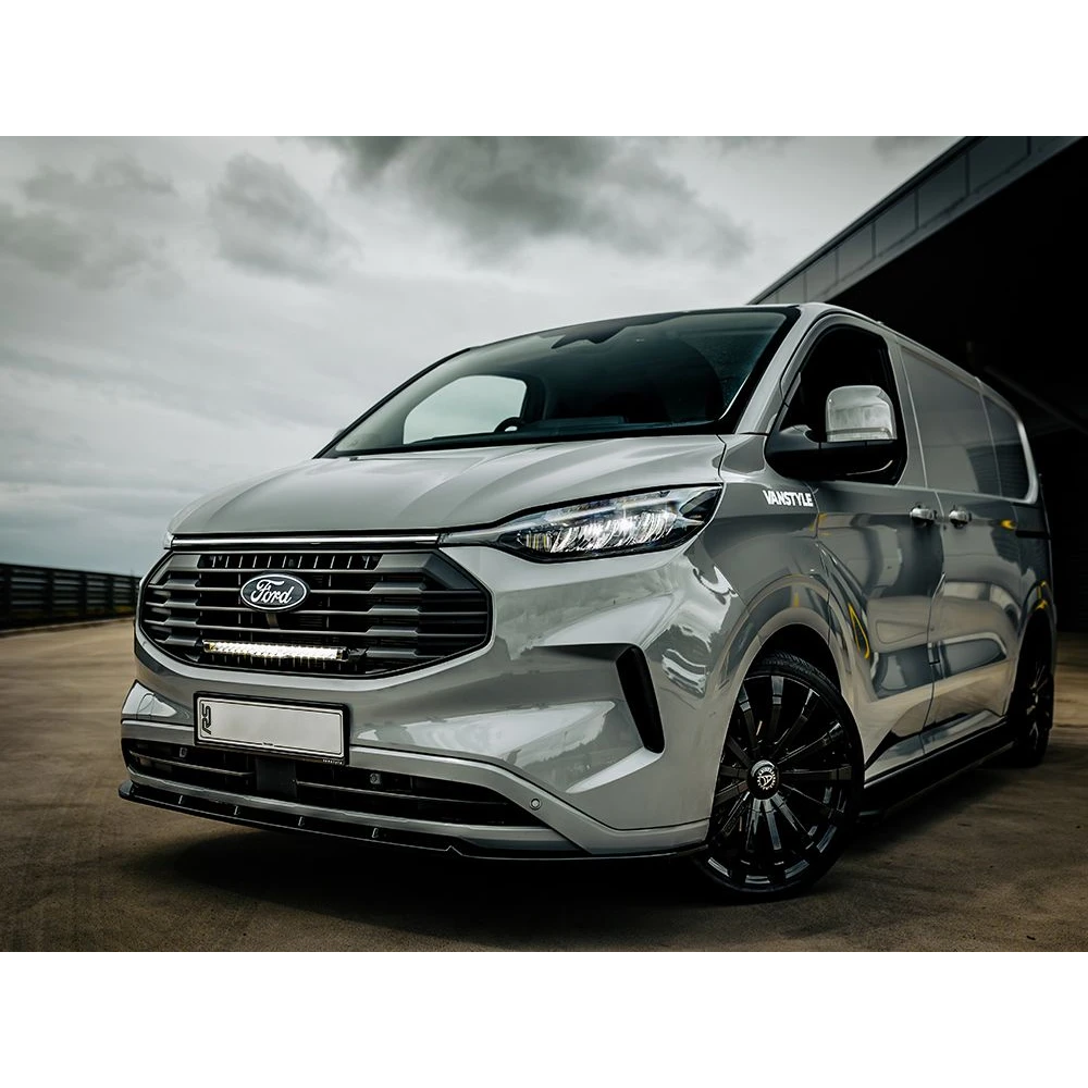 Ford Transit Custom (2024+) Grille Kit fitted to a silver Ford van parked on a road under a cloudy sky