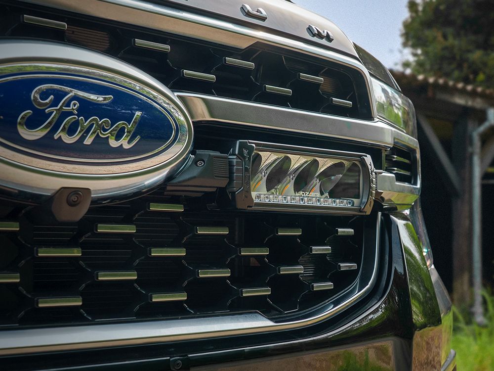 Close-up of a Ford vehicle grille with logo