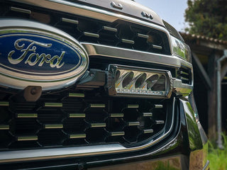 Close-up of a Ford vehicle grille with logo