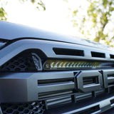Close-up of a Ford Ranger Raptor grille with Lazer Lamps Grille Kit – Ford Ranger Raptor (2018–2022) installed, outdoors.