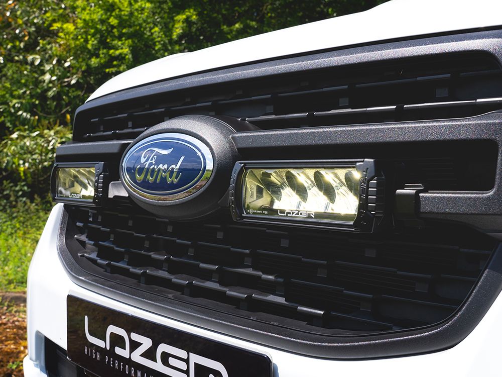 Close-up of a Ford vehicle grille with 'Lazer' branding.