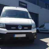 White Volkswagen van in front of a building with 'Lazer' branding.