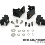 Set of black plastic brackets and metal bolts on a white background with text indicating compatibility for Ford F-150 Raptor.