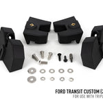 Black automotive suspension lift kit components with screws and washers on a white background, labeled for Ford Transit Custom.