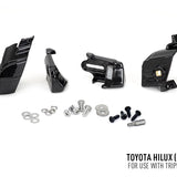 Set of black mechanical parts and screws on a white background with Toyota Hilux 2017+ text.