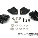 Set of black mechanical components and screws on a white background with Toyota Land Cruiser 250 text.