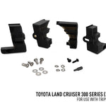 Set of black mechanical components and hardware on a white background with Toyota Land Cruiser 300 Series text.