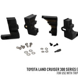 Set of black mechanical components and hardware on a white background with Toyota Land Cruiser 300 Series text.