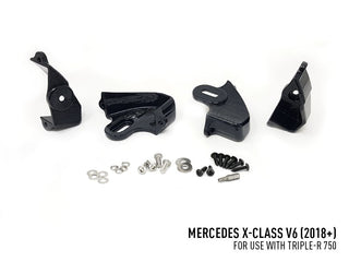 Black mechanical parts and hardware on a white background with Mercedes X-Class V6 text.