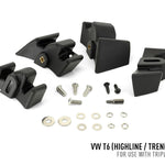 Black car roof rack components with screws and washers on a white background