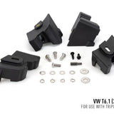 Set of black mechanical components and hardware on a white background