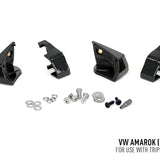 Set of black metal brackets and small metal components on a white background with text indicating compatibility for VW Amarok.