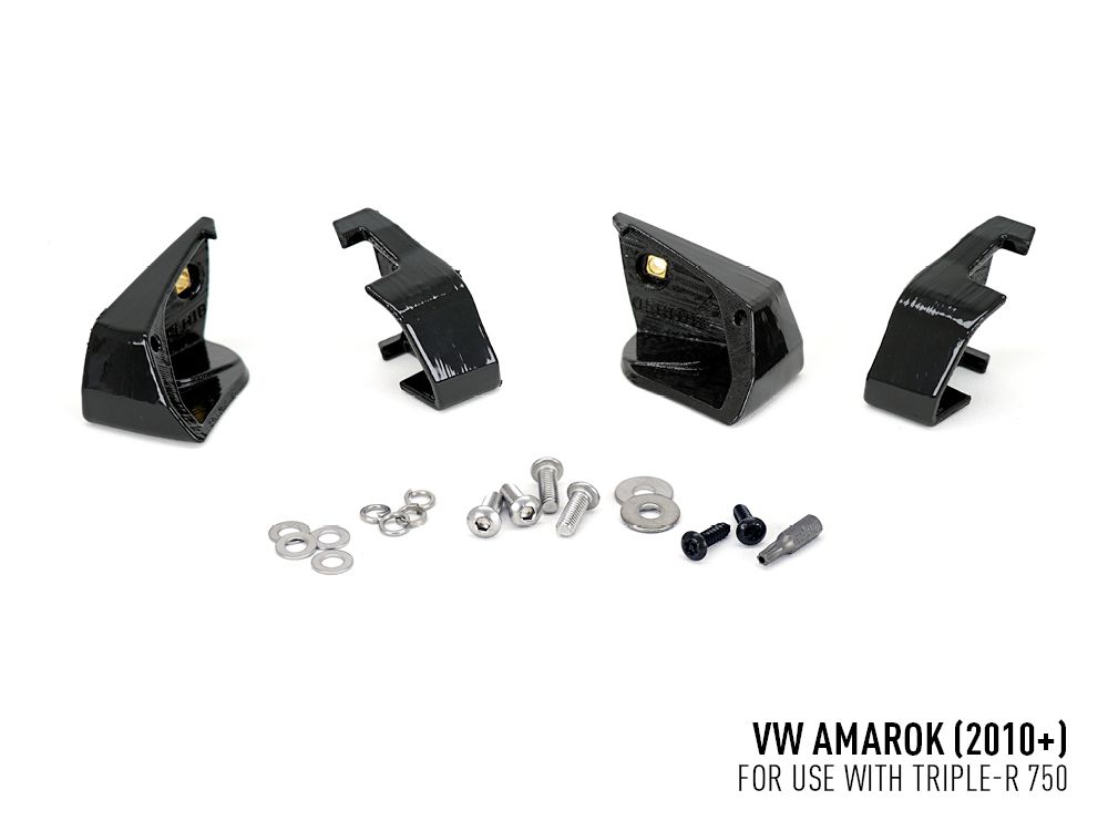 Set of black metal brackets and small metal components on a white background with text indicating compatibility for VW Amarok.