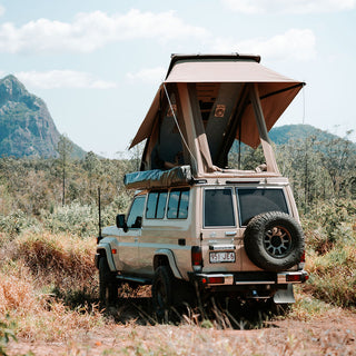 78 Series Troopy with the Headspace roof raised in a mountain landscape