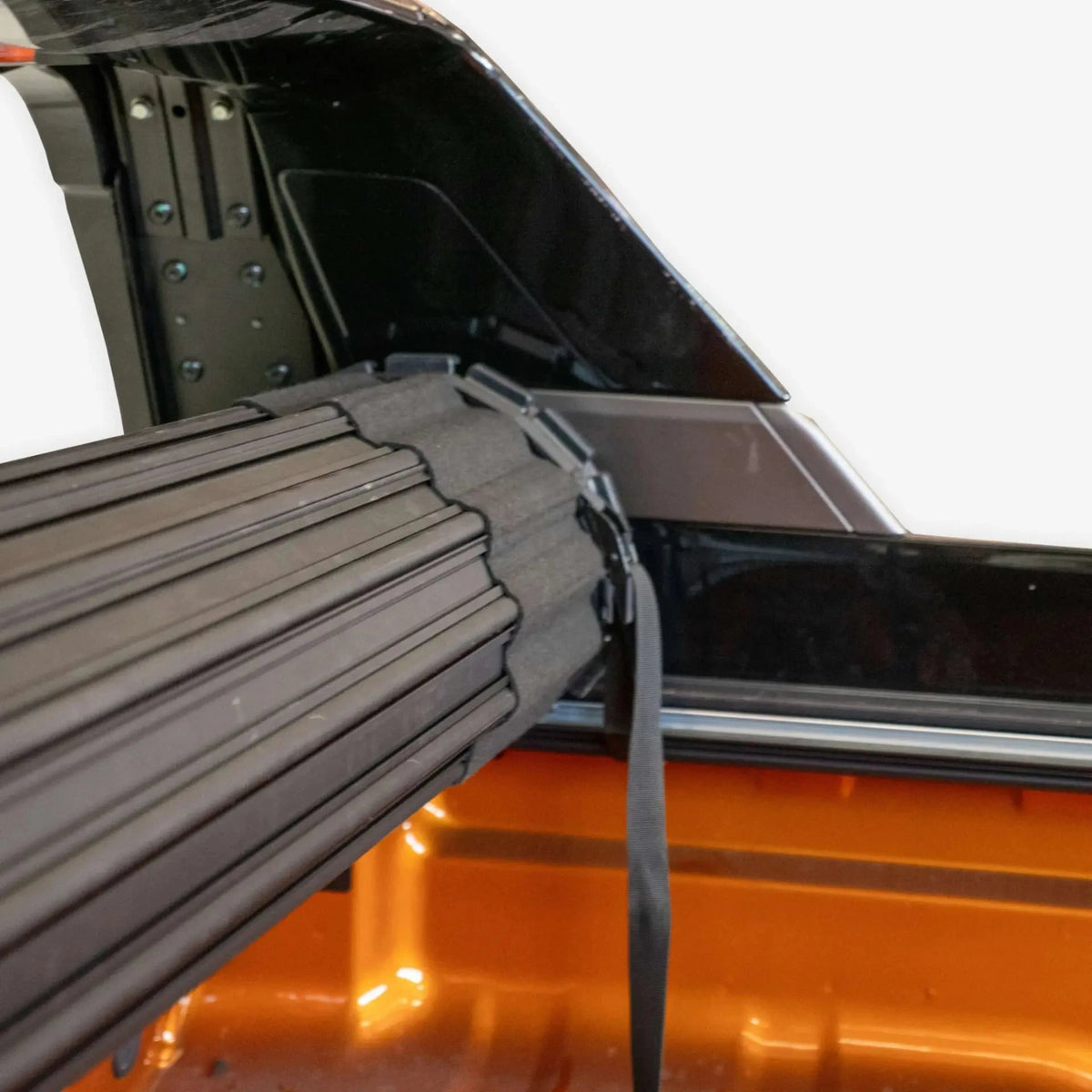 Car tub cover system on a vehicle with a white background – HSP Roll Mate Mitsubishi Triton MV