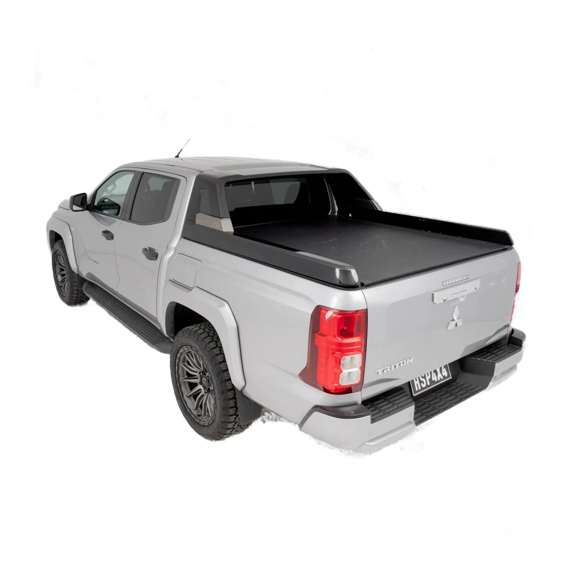 Silver pickup truck with a black tonneau cover on a white background – HSP Roll Mate Mitsubishi Triton MV
