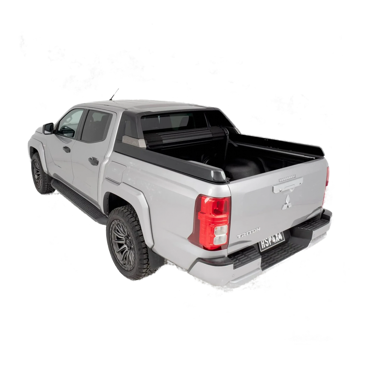 Silver pickup truck with a black tonneau cover on a white background – HSP Roll Mate Mitsubishi Triton MV