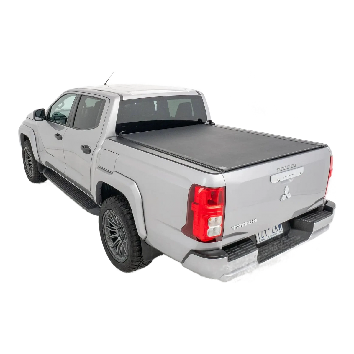 Silver pickup truck with a tonneau cover on a white background – HSP Roll Mate Mitsubishi Triton MV