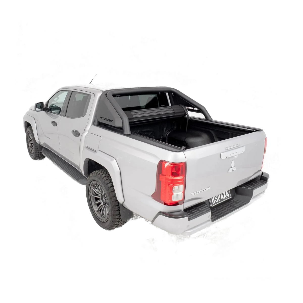 Silver Mitsubishi Triton pickup truck with a black tonneau cover on a white background