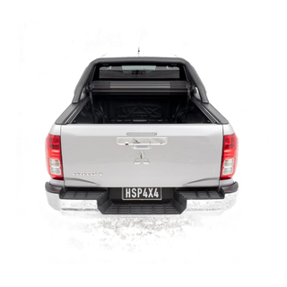 Back view of a silver Mitsubishi pickup truck on a white background