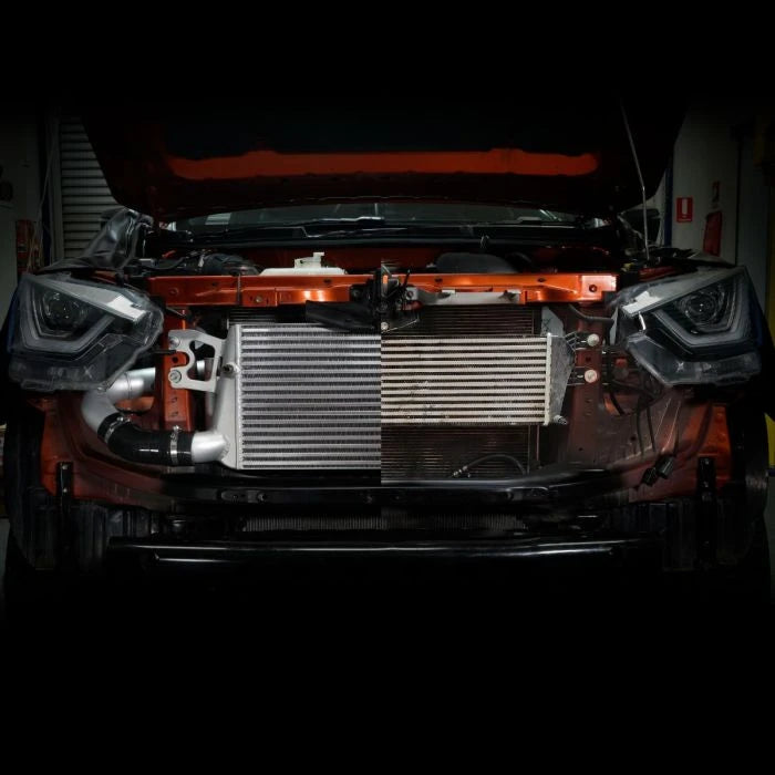 Bonnet open in a workshop showing the intercooler installation – FRONT MOUNT INTERCOOLER - ISUZU DMAX / MU-X / MAZDA BT50 3.0L 4JJ3