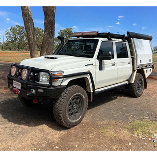 White off-road vehicle with black accents on a dirt road – Landcruiser 70-79 Series MSA POWER FOLD Towing Mirrors