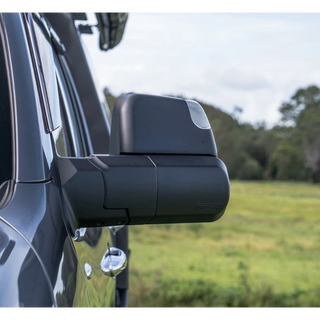 Side view of a vehicle's mirror with a blurred natural background – Landcruiser 70-79 Series MSA POWER FOLD Towing Mirrors