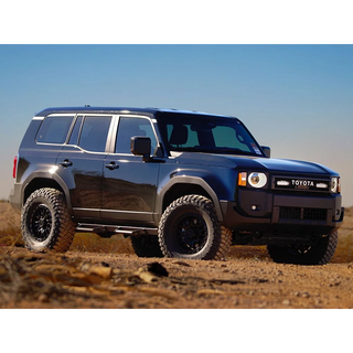 Toyota Prado 250 SUV on a dirt road with a clear blue sky