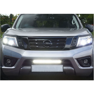 Front view of a silver Nissan vehicle with headlights on with Lazer Lamps Nissan Navara (2014-2021) Kit