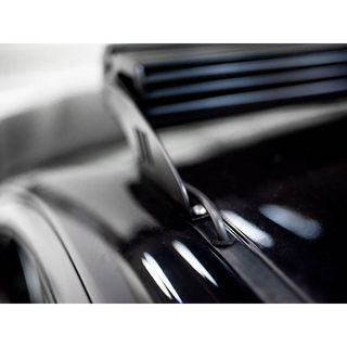 Close-up of a car's grille with a blurred background