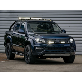 Black Volkswagen Amarok pickup truck with additional lights on a gray background with Lazer Lamps Grille Kit for VW Amarok V6 (2016–2022)