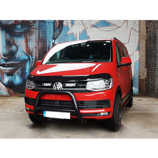 Red Volkswagen van in front of a graffiti-covered wall