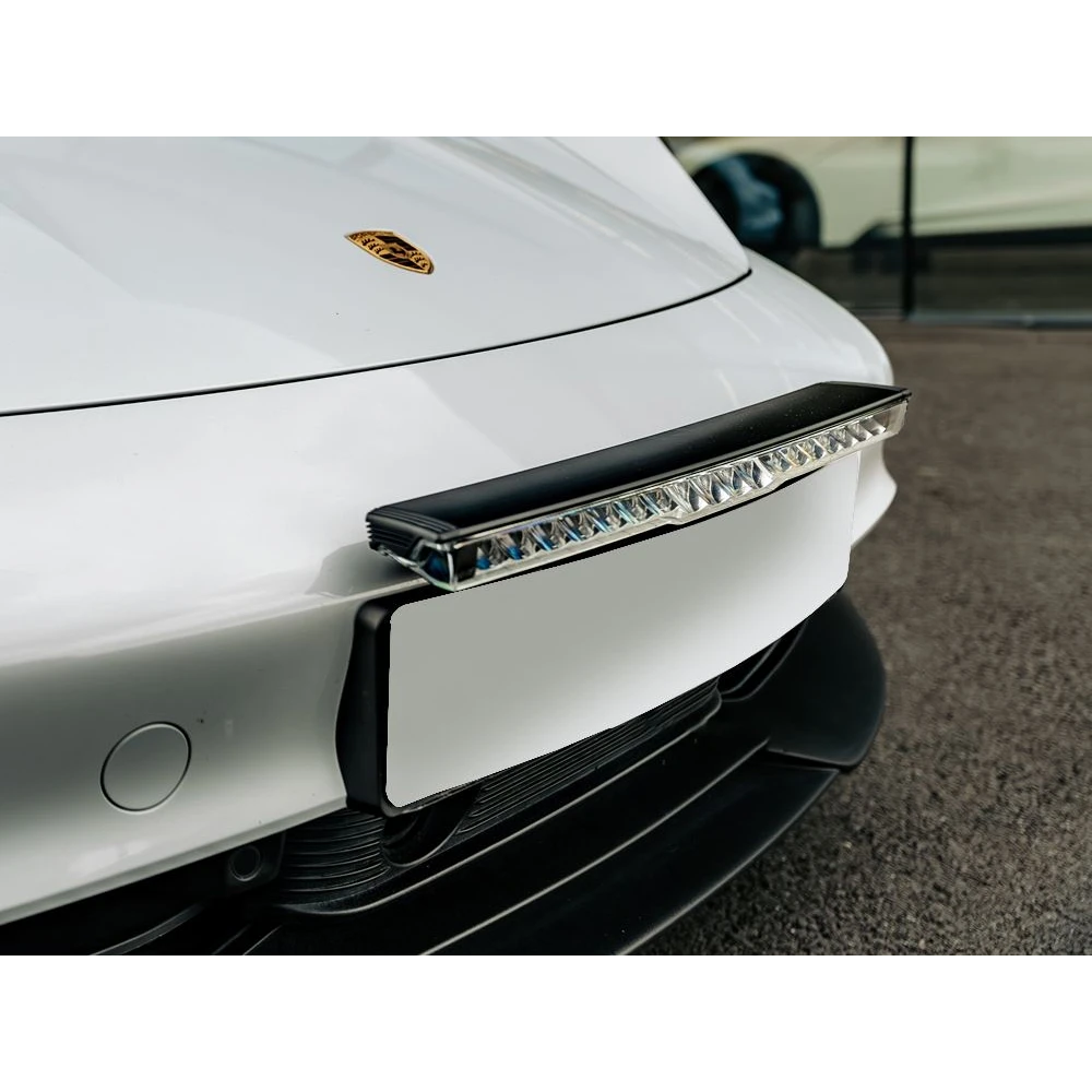 Lazerlamps Licence Plate Mount (Glide) fitted to the front bumper of a white car