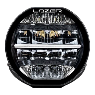 A black 7-inch Lazerlamps Sentinel LED driving light with a clear polycarbonate lens, designed for vehicles or tight mounting setups, featuring advanced LED technology.