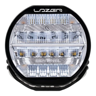 A black 7-inch Lazerlamps Sentinel LED driving light with a clear polycarbonate lens, designed for vehicles or tight mounting setups, featuring advanced LED technology.