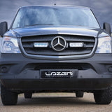 Mercedes-Benz truck with 'Lazer' branding on a beach