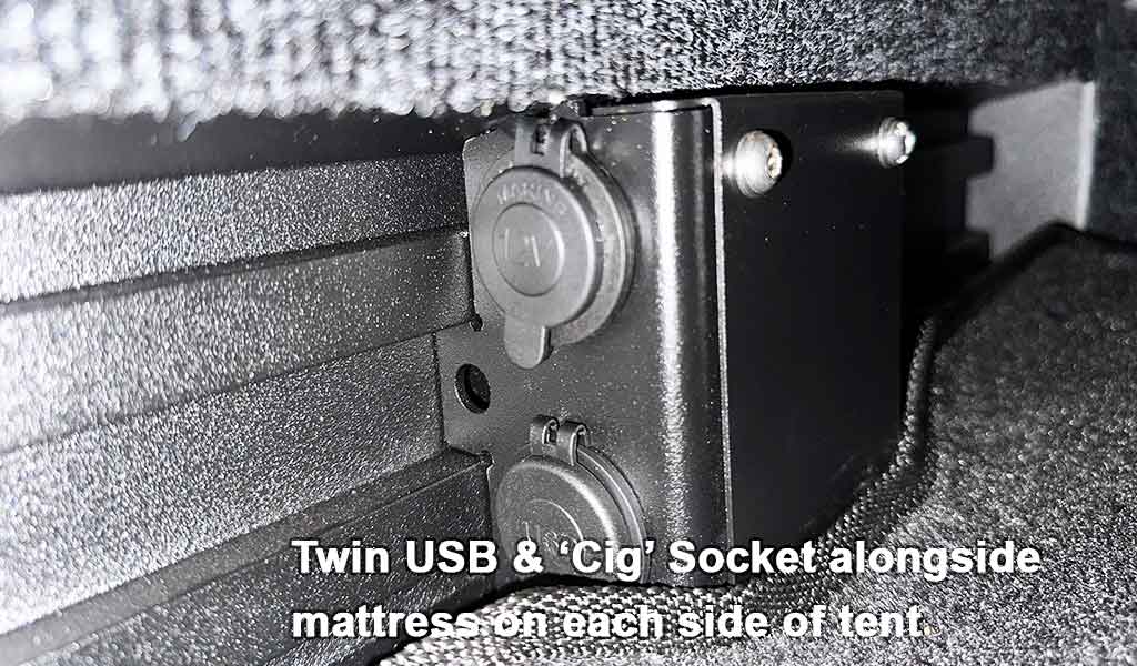 Twin USB and 'Cig' socket attached to a mattress on each side of a tent.