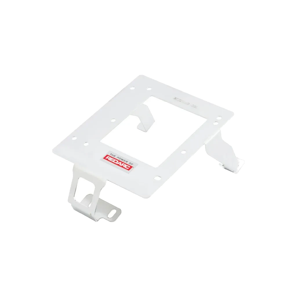 White Redarc mounting bracket at an angle, the plate with a central cut-out and two retaining tangs, with slotted feet at opposite corners